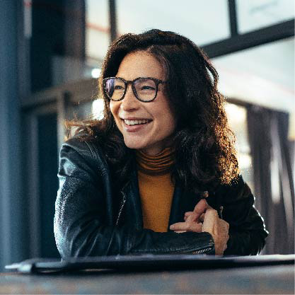 A portrait of a woman smiling at work