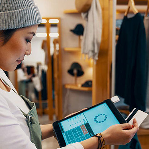 woman checking something on tablet