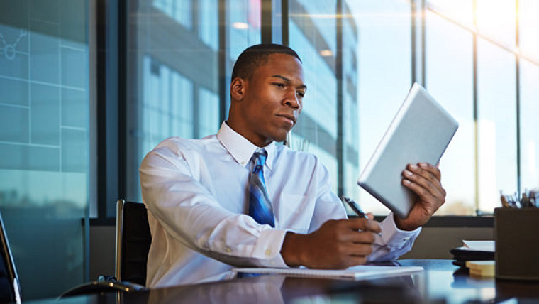 Man looking at tablet