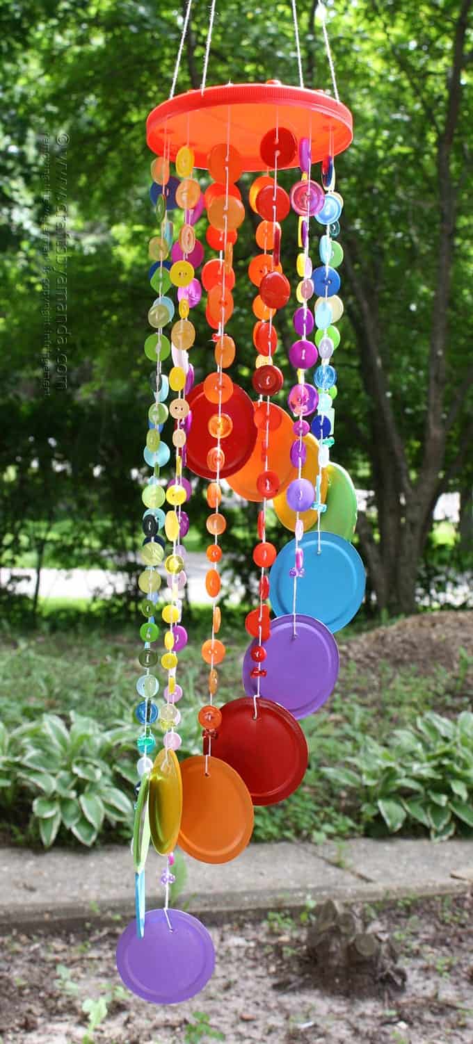 This button wind chime in rainbow colors is one of my favorite projects in my new book. It's an awesome kid's craft or adult craft for summer! #rainbowcrafts #windchimes #buttoncrafts #buttons #gardencrafts #gardendecor #recycledcrafts #kidscrafts #adultcrafts Rainbow Button Wind Chime