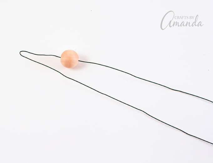 Fold each piece of wire in half.