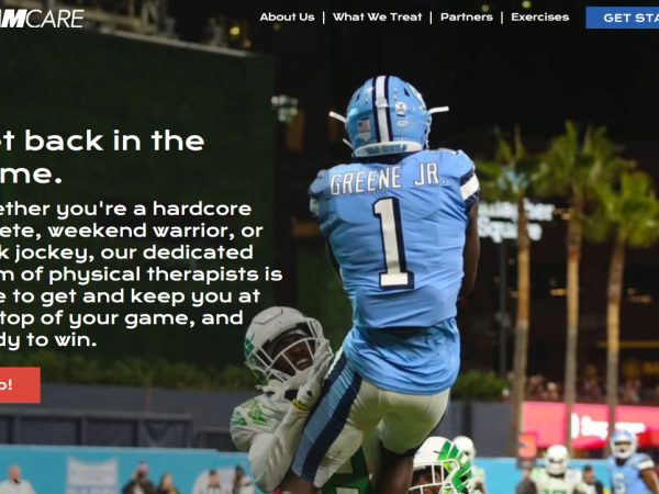Top of homepage of PT website - NC football player catching a ball