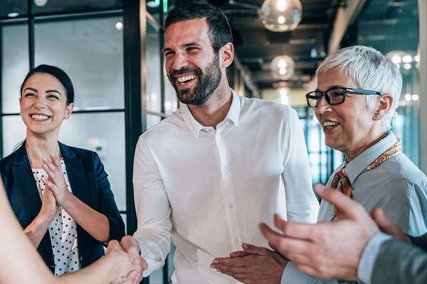 Businesspeople shaking hands at a meeting