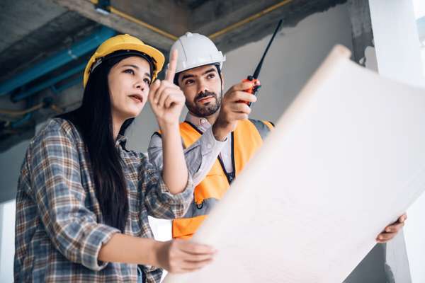 Construction site managers discussing plans 