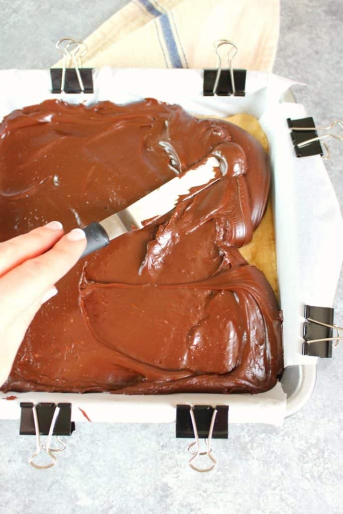 If you're looking for an amazing peanut butter fudge recipe look no further! This incredible Layered Chocolate & Peanut Butter Fudge is super simple to make and the perfect Christmas candy recipe!