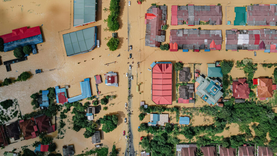 An aerial view of a flooded town.