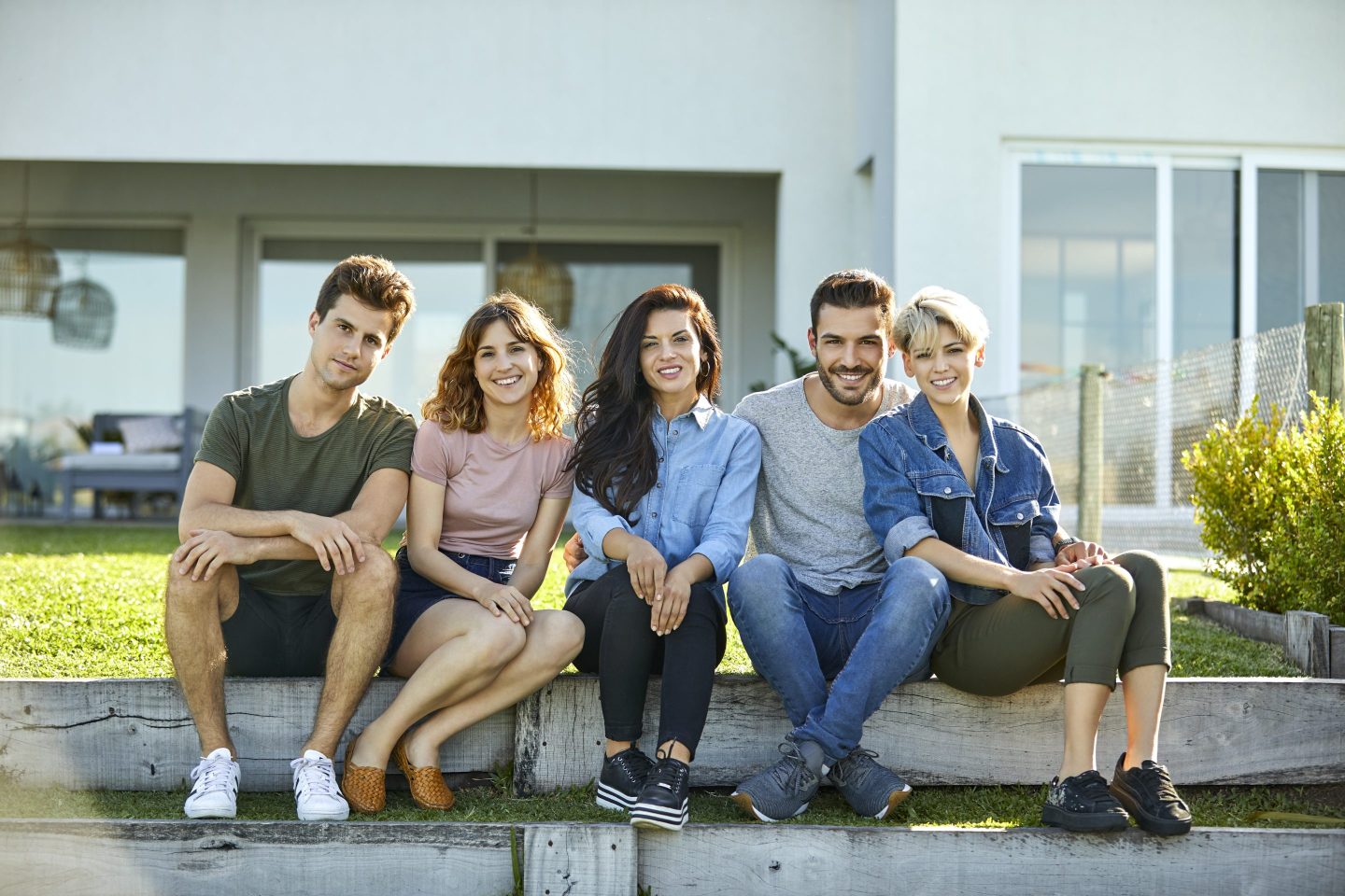 Happy friends in backyard during social gathering