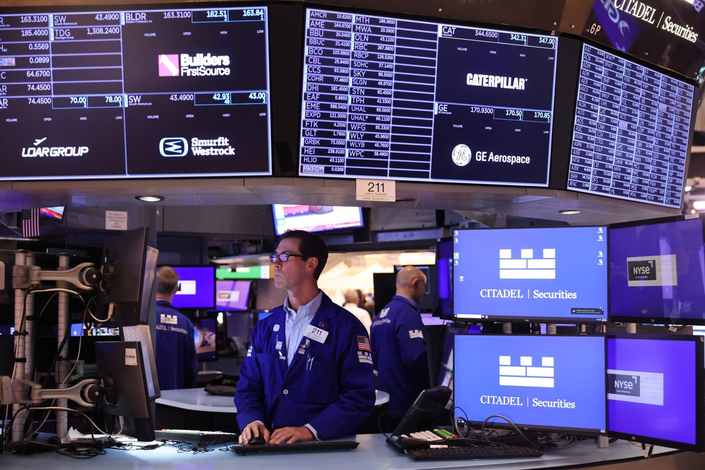 Traders work on the floor of the New York Stock Exchange.