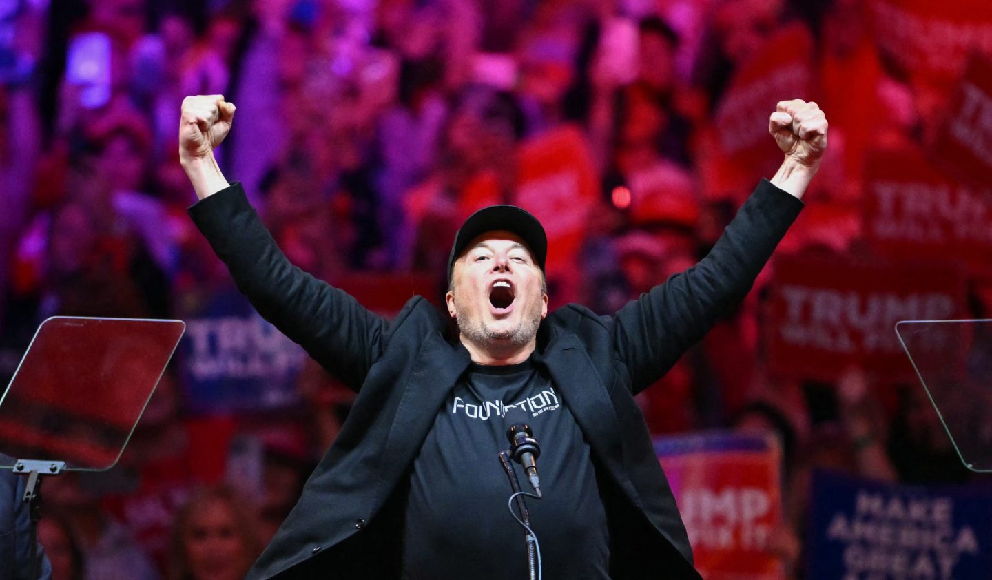 Tesla and SpaceX CEO Elon Musk gestures as he steps on stage during a rally for President-elect Donald Trump