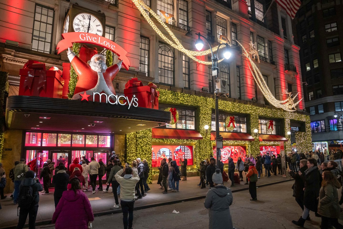 People line up outside of Macy's flagship store in New York City before opening on Black Friday.