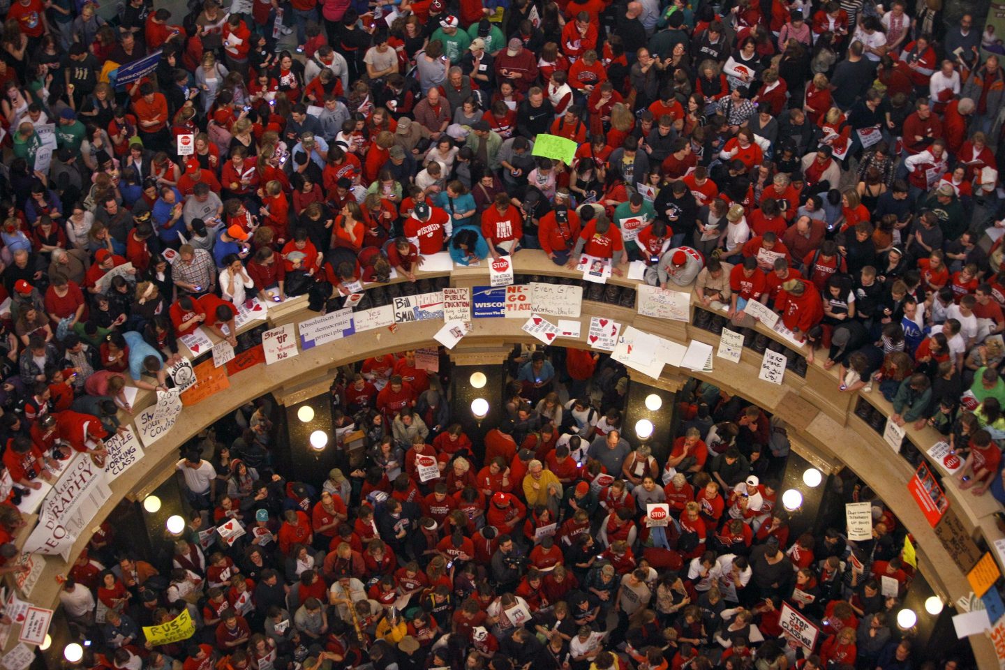 This photo taken Feb. 17, 2011 shows protestors of Wisconsin Gov. Scott Walker's bill to eliminate collective bargaining rights for many state workers packing the rotunda at the State Capitol in Madison, Wis.