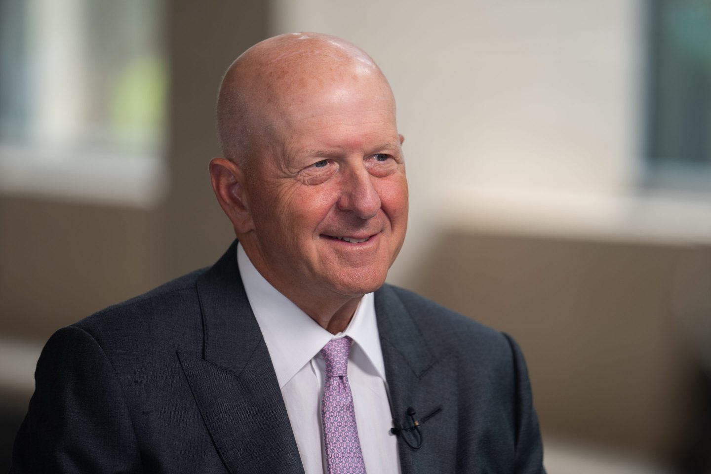 David Solomon smiles at the camera during an interview.