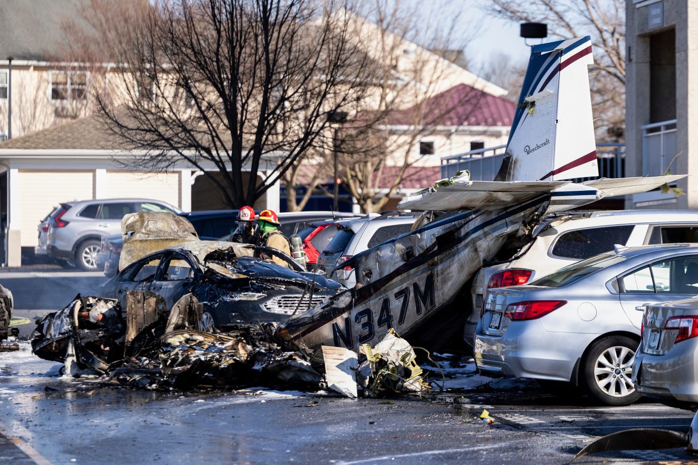 First responders work the scene after a plane crashed in the parking lot of a retirement community in Manheim Township, Pa., on March 9, 2025.