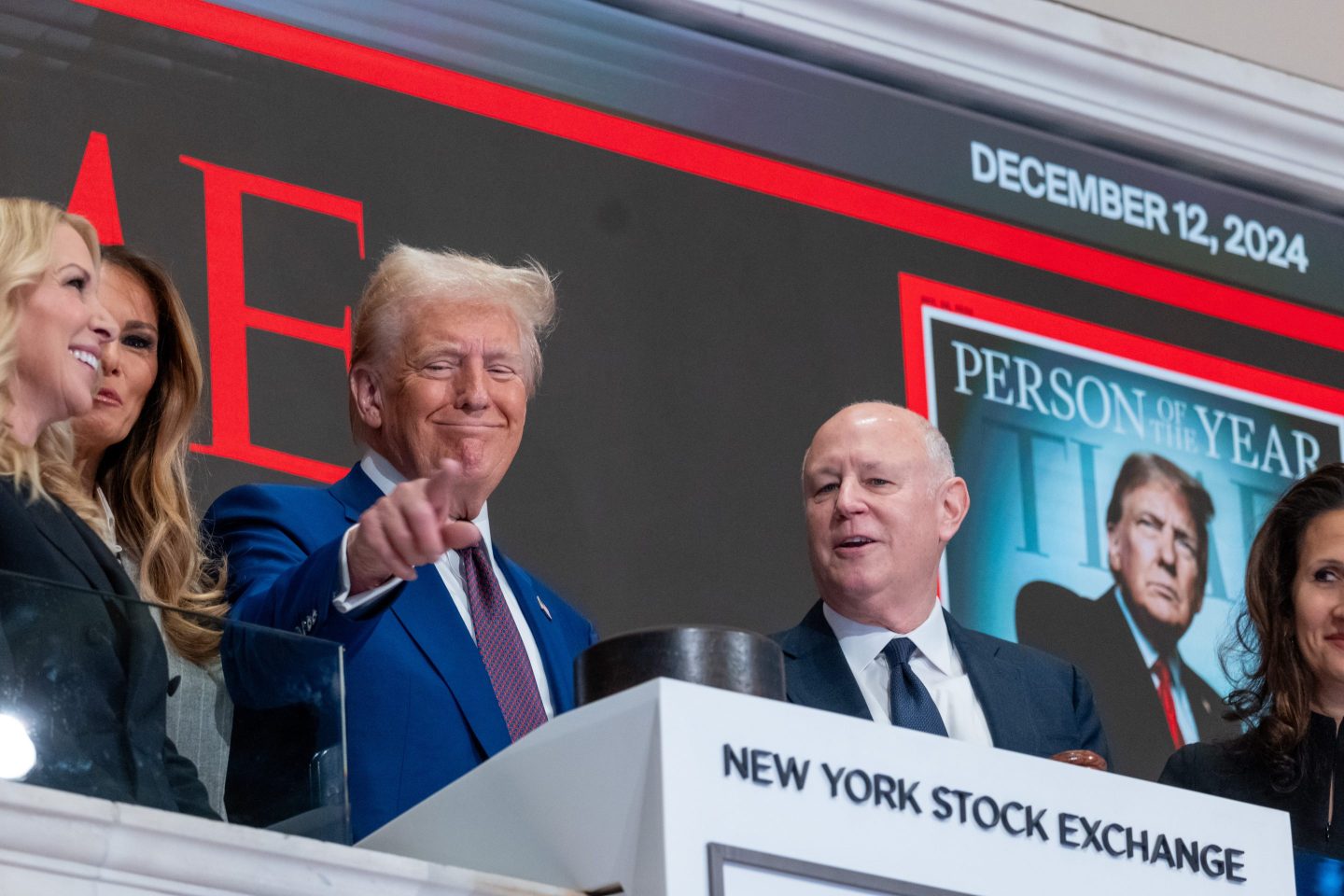 President-elect Donald Trump points out into a crowd as he rings the opening bell on the trading floor of the New York Stock Exchange (NYSE) on December 12, 2024 in New York City.