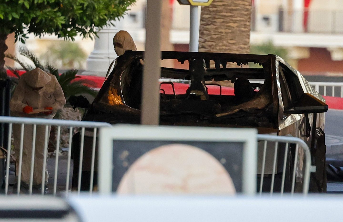 First responders wearing Hazmat gear investigate a Tesla Cybertruck that exploded in front of the entrance to the Trump International Hotel &amp; Tower Las Vegas on January 01, 2025 in Las Vegas, Nevada.