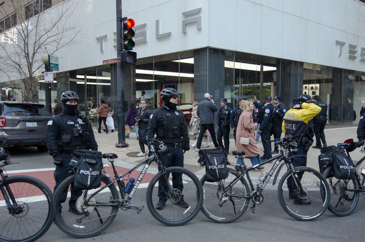 Police officers standing outside a Tesla dealership in Chicago