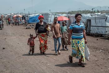 People walk through a camp for displaced people close to Goma in the eastern Democratic Republic of the Congo. 