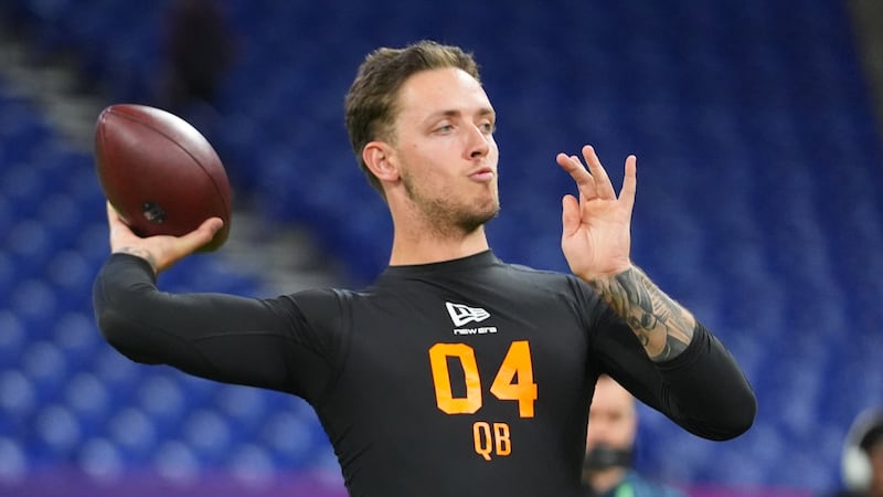 FILE - Miami quarterback Carson Beck (04) runs a drill at the NFL football scouting combine in...
