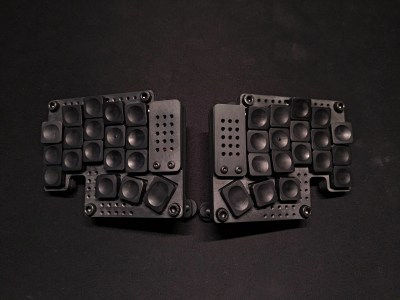 An incredibly industrial-looking split keyboard. Like, almost H.R. Geiger-esque.