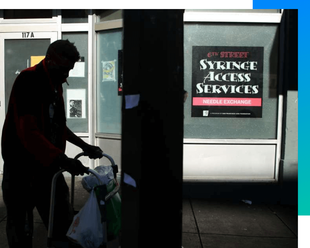 SyringeAccess-01 Person with a walker, passing in the front of the 6th street needle exchange