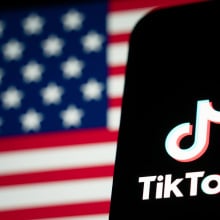 The TikTok logo and flag of the United States are seen on screens on January 18, 2025 in Hong Kong, China. As the impending TikTok ban looms, users are increasingly migrating to alternative platforms like Xiaohongshu, driven by concerns over data privacy and the potential shutdown of their favorite app. This shift reflects a broader trend where users seek platforms that offer similar engagement without the uncertainty surrounding TikTok's future in the U.S., especially as legal battles and political pressures mount ahead of the January 19 deadline for compliance or a ban.