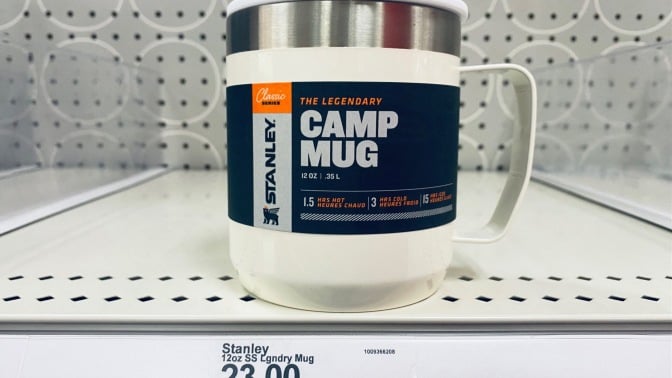 a stanley camping mug on a shelf