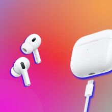 airpods case and earbuds on a colorful gradient background