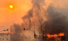 Flames from the wind-driven Eaton Fire engulf a house in Altadena, California,