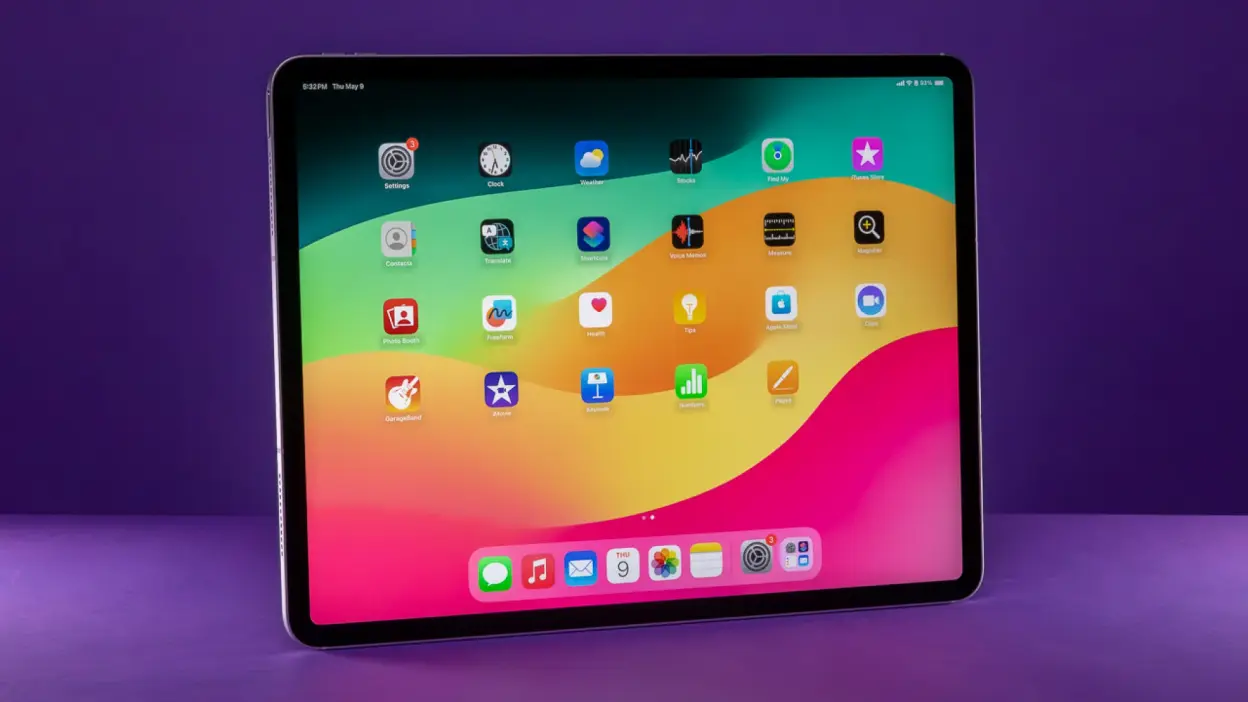 An iPad Air on a purple background