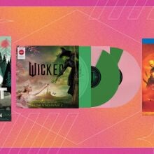 from left to right: the wild robot book, the wicked soundtrack on vinyl, and dune: part two on blu-ray on a pink and orange patterned background