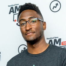 Marques Brownlee in glasses and a gray shirt.