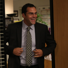 David Wallace, Dunder Mifflin's CFO, walking into the conference room