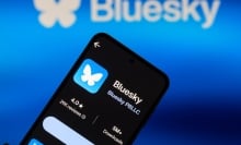 Blueksy logo on a smartphone and appearing in the background.