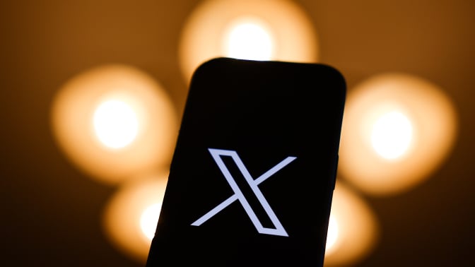 X logo on mobile device