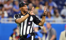 Umpire Terry Killens, Jr. (77) makes a call during the first half of an NFL preseason football game between the Detroit Lions and the Buffalo Bills in Detroit, Michigan, on Friday, Aug. 13, 2021.