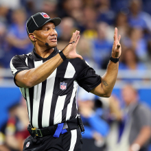 Umpire Terry Killens, Jr. (77) makes a call during the first half of an NFL preseason football game between the Detroit Lions and the Buffalo Bills in Detroit, Michigan, on Friday, Aug. 13, 2021.