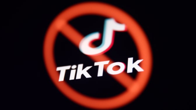 tiktok logo with a red x circle through it