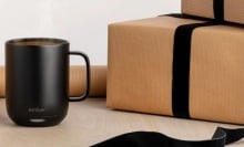 black ember mug 2 next to wrapped presents