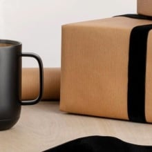 black ember mug 2 next to wrapped presents