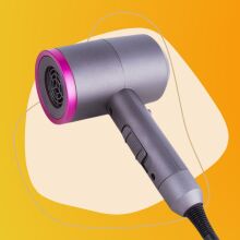 Multifunctional Electric Hair Dryer on a colorful background.