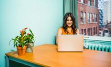 Girl using laptop at desk