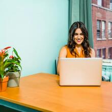 Girl using laptop at desk