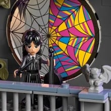 a view of the Lego version of the circular window in wednesday and enid's dorm room from the netflix show "wednesday"