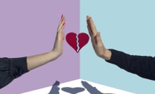 Two people hold up outstretched palms with a broken heart in between their hands.