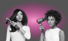 Two people styling hair with Dyson hair tools with gray and pink graphic in background