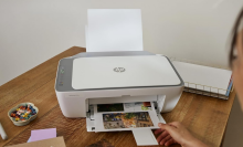 A person printing photos with an HP printer