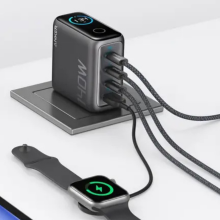 An Anker charger charging four different devices.