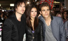 Ian Somerhalder, Nina Dobrev, and Paul Wesley pose at an event. 