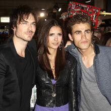 Ian Somerhalder, Nina Dobrev, and Paul Wesley pose at an event. 