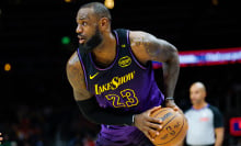 LeBron James #23 of the Los Angeles Lakers looks to pass during the second quarter against the Atlanta Hawks at State Farm Arena on December 6, 2024 in Atlanta, Georgia.